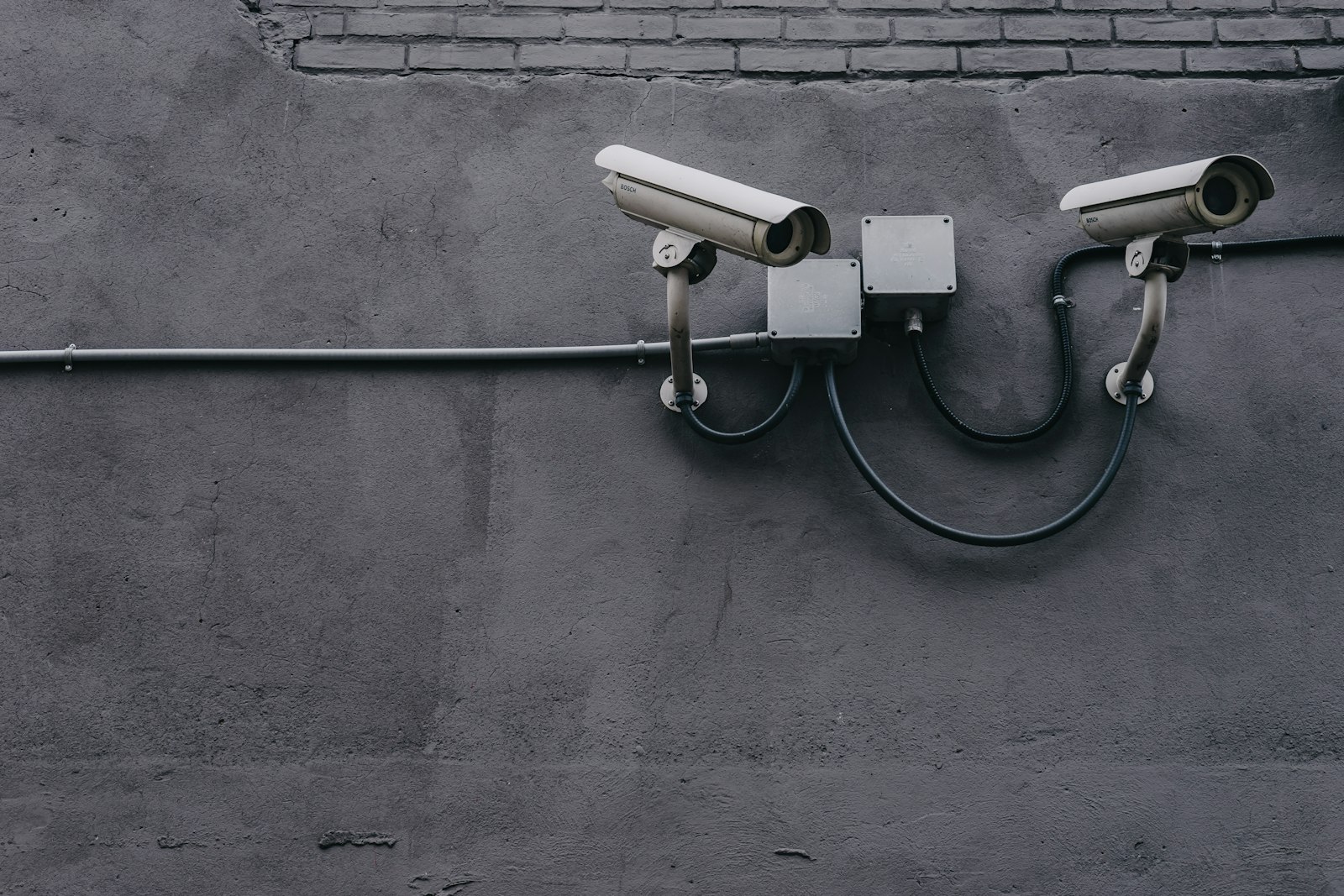 A surveillance camera mounted on the exterior of a building