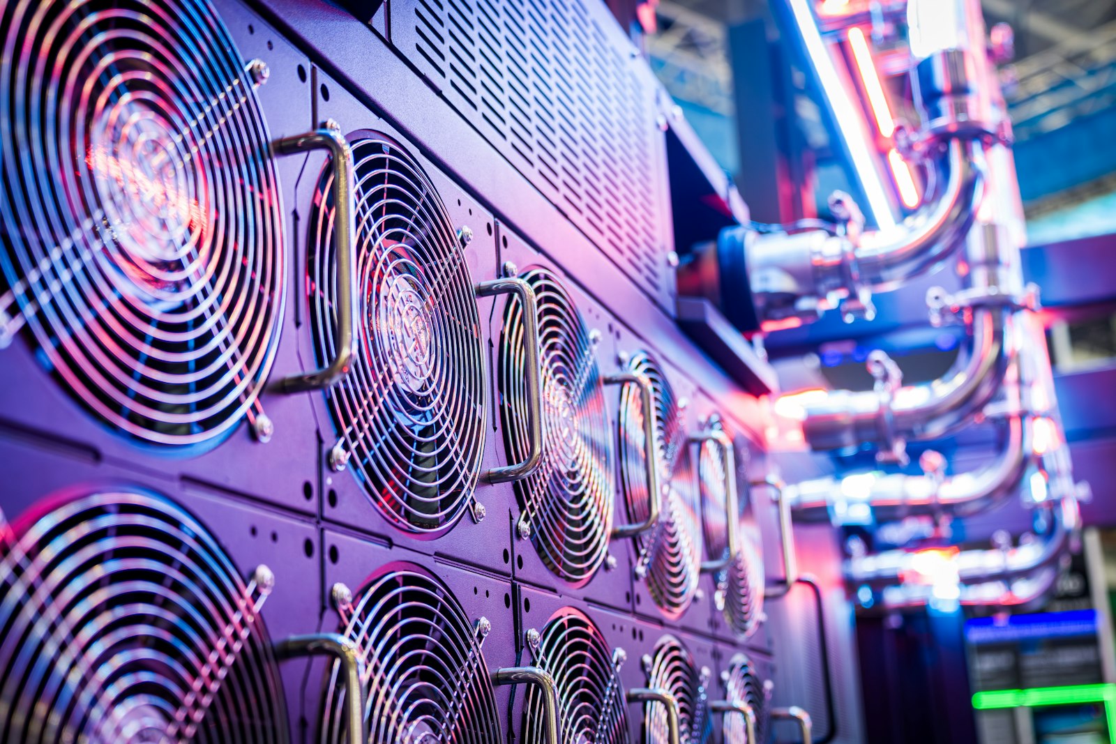 Close-up of server cooling fans in a vibrant data center.